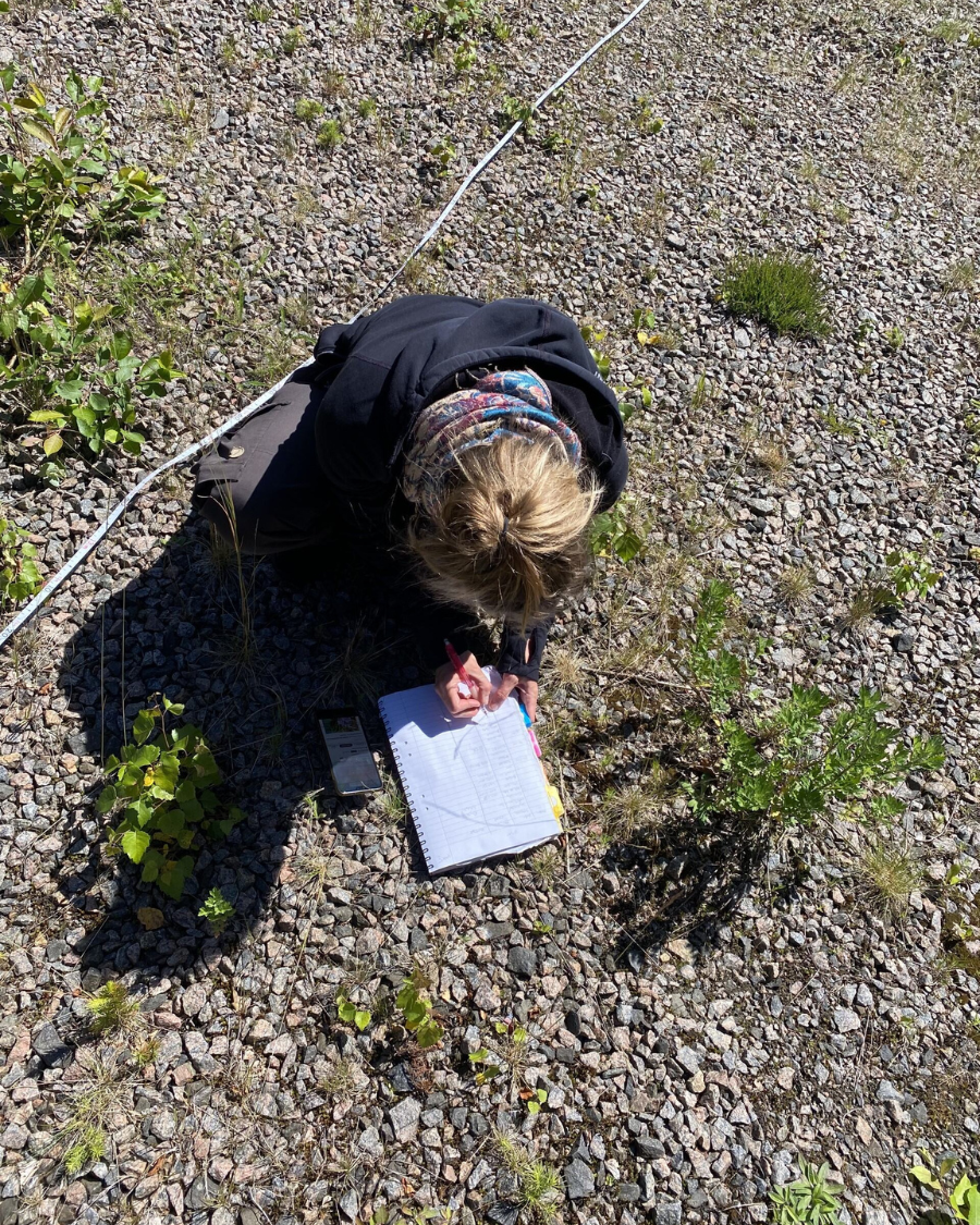 Girl in forest writing thesis project biodiversity windparks